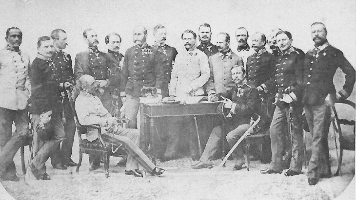 The headquarters staff in Italy. John centre with Benedek seated at John's right,
